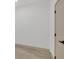 Bright bedroom with light wood flooring and a white door at 16489 Trading Post Rd, Punta Gorda, FL 33955