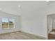 Comfortable bedroom showcasing hardwood floors, a view from the window, and a neutral color scheme at 16489 Trading Post Rd, Punta Gorda, FL 33955
