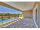 Covered patio leading to a pool area with a safety fence at 16489 Trading Post Rd, Punta Gorda, FL 33955
