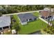 An aerial view of a home with a spacious backyard and covered patio at 1826 Narrington Ave, North Port, FL 34288