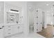 Bright bathroom featuring marble floors, modern vanity, and ample space at 1826 Narrington Ave, North Port, FL 34288