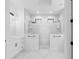 Modern bathroom with double shower, marble tile and dual sink vanities at 1826 Narrington Ave, North Port, FL 34288