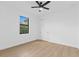 Comfortable bedroom with ceiling fan and natural light from a window at 1826 Narrington Ave, North Port, FL 34288