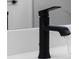 Close-up of sleek matte black bathroom faucet and white countertop at 1826 Narrington Ave, North Port, FL 34288