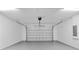 The interior of a clean, organized two car garage with white walls at 1826 Narrington Ave, North Port, FL 34288