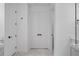 Hallway with marble flooring and modern doors and fixtures at 1826 Narrington Ave, North Port, FL 34288