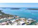 Aerial view of canal front homes and clear blue water on a sunny day at 1905 Pennsylvania Ave, Englewood, FL 34224