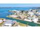 Aerial view of homes with boat docks on a canal with waterway in the distance at 1905 Pennsylvania Ave, Englewood, FL 34224