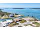 Aerial view of canal front homes and clear blue water on a sunny day at 1905 Pennsylvania Ave, Englewood, FL 34224