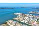 Aerial view of waterfront homes, clear blue water, and islands on a sunny day at 1905 Pennsylvania Ave, Englewood, FL 34224