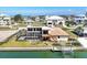 Charming waterfront home featuring a screened pool, dock, and inviting outdoor living spaces with waterway views at 1905 Pennsylvania Ave, Englewood, FL 34224