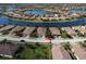 Beautiful aerial view of homes in a lakeside community with manicured landscaping and tile roofs at 20171 Tesoro Dr, Venice, FL 34293