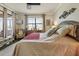 Bright bedroom includes a large window, comfortable seating, and elegant decor at 20171 Tesoro Dr, Venice, FL 34293