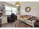 Inviting home office with custom built-ins, desk, comfortable seating, and ample natural light at 20171 Tesoro Dr, Venice, FL 34293
