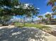 Community playground with slides, climbing structures, and a soft, green play surface at 20171 Tesoro Dr, Venice, FL 34293