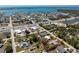 Aerial view of a single-story home surrounded by the intercoastal waterway, highway, and commercial areas, outlined in red at 2033 Georgia Ave, Englewood, FL 34224