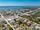 Aerial view features a single-story home near the ocean and major roads, showcasing its convenient location, outlined in red at 2033 Georgia Ave, Englewood, FL 34224
