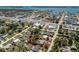Aerial view of a home with a sprawling, tree-filled yard, surrounded by streets and waterways at 2033 Georgia Ave, Englewood, FL 34224