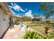 Expansive backyard with lush greenery and a charming patio area, perfect for outdoor living at 2033 Georgia Ave, Englewood, FL 34224