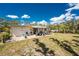 Relaxing backyard features a patio with comfortable seating and a spacious yard surrounded by lush greenery at 2033 Georgia Ave, Englewood, FL 34224