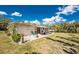 Lush backyard featuring a patio and well-maintained lawn, creating a perfect outdoor oasis at 2033 Georgia Ave, Englewood, FL 34224
