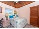Comfortable bedroom with a window view and marine themed decor providing a relaxing coastal atmosphere at 2033 Georgia Ave, Englewood, FL 34224