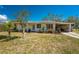 Charming single-story home featuring a carport, a well-maintained lawn, and mature landscaping at 2033 Georgia Ave, Englewood, FL 34224