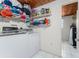 Bright laundry room with washer, dryer, and ample shelving for storage at 2033 Georgia Ave, Englewood, FL 34224