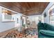 Living room featuring wood ceilings, lots of natural light, and modern decor at 2033 Georgia Ave, Englewood, FL 34224