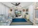 Cozy sun room featuring patterned chairs and access to the backyard seating area at 2033 Georgia Ave, Englewood, FL 34224