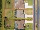A clear overhead view shows the layout of the property, highlighting the pool, lawn, landscaping, and street access at 212 Rotonda E Blvd, Rotonda West, FL 33947