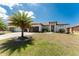 Newly constructed home with a three-car garage, well-kept lawn, and fresh curb appeal at 212 Rotonda E Blvd, Rotonda West, FL 33947