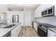 This well-equipped kitchen features stainless steel appliances, granite counters, and a large sink at 212 Rotonda E Blvd, Rotonda West, FL 33947