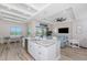 Open kitchen design with a large island, stainless steel appliances, and seamless integration with living and dining areas at 212 Rotonda E Blvd, Rotonda West, FL 33947
