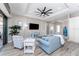 Comfortable living room features recessed lighting, stylish furniture, and a seamless connection to the outdoor living space at 212 Rotonda E Blvd, Rotonda West, FL 33947