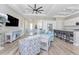 Expansive living space features an open layout with a modern kitchen, comfortable seating, and access to outdoor areas at 212 Rotonda E Blvd, Rotonda West, FL 33947