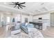 Open-concept living space featuring a modern kitchen with island seating and a comfortable living area at 212 Rotonda E Blvd, Rotonda West, FL 33947