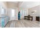 This home office features tile floors, a desk, and a colorful accent piece for storage at 212 Rotonda E Blvd, Rotonda West, FL 33947