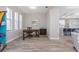 Bright office space featuring wood-look tile flooring, a wooden desk, and natural light from the window at 212 Rotonda E Blvd, Rotonda West, FL 33947