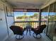 Cozy balcony with comfortable seating overlooking a landscaped exterior; the perfect relaxation spot at 22375 Edgewater Dr # F219, Port Charlotte, FL 33980