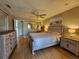 Bright bedroom featuring wood-look floors and a relaxing atmosphere at 22375 Edgewater Dr # F219, Port Charlotte, FL 33980