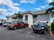 Well-kept two-story condo building featuring ample parking and well-maintained landscaping at 22375 Edgewater Dr # F219, Port Charlotte, FL 33980