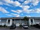 Condo building with well-maintained landscaping and convenient parking spaces for residents at 22375 Edgewater Dr # F219, Port Charlotte, FL 33980