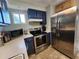 Well-lit kitchen with stainless steel appliances and ample counter space at 22375 Edgewater Dr # F219, Port Charlotte, FL 33980