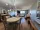 Open-plan living and dining area with stylish light fixture and comfortable seating at 22375 Edgewater Dr # F219, Port Charlotte, FL 33980