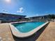 A sparkling community swimming pool offers a refreshing escape with ample lounging space for residents at 22375 Edgewater Dr # F219, Port Charlotte, FL 33980