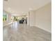 Open-concept living room and kitchen features a spacious layout and neutral decor at 234 Cougar Way, Rotonda West, FL 33947