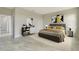 Bedroom with a grey bed frame and neutral walls with stylish decor at 234 Cougar Way, Rotonda West, FL 33947