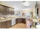 Bright kitchen featuring granite counters, wood cabinets, and stainless steel appliances at 2700 Sheboygan Ave, North Port, FL 34286