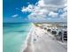 Beautiful beachside condos on a gorgeous, pristine beach with turquoise water on a bright, sunny day at 2792 N Beach Rd # 301, Englewood, FL 34223